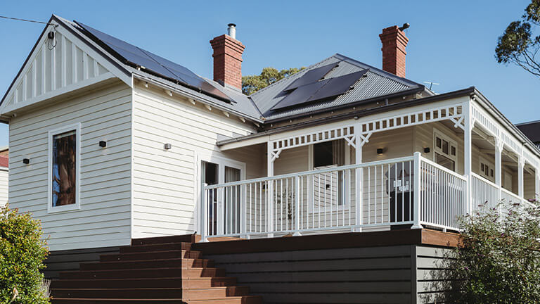 Homestead exterior with verandah, garden